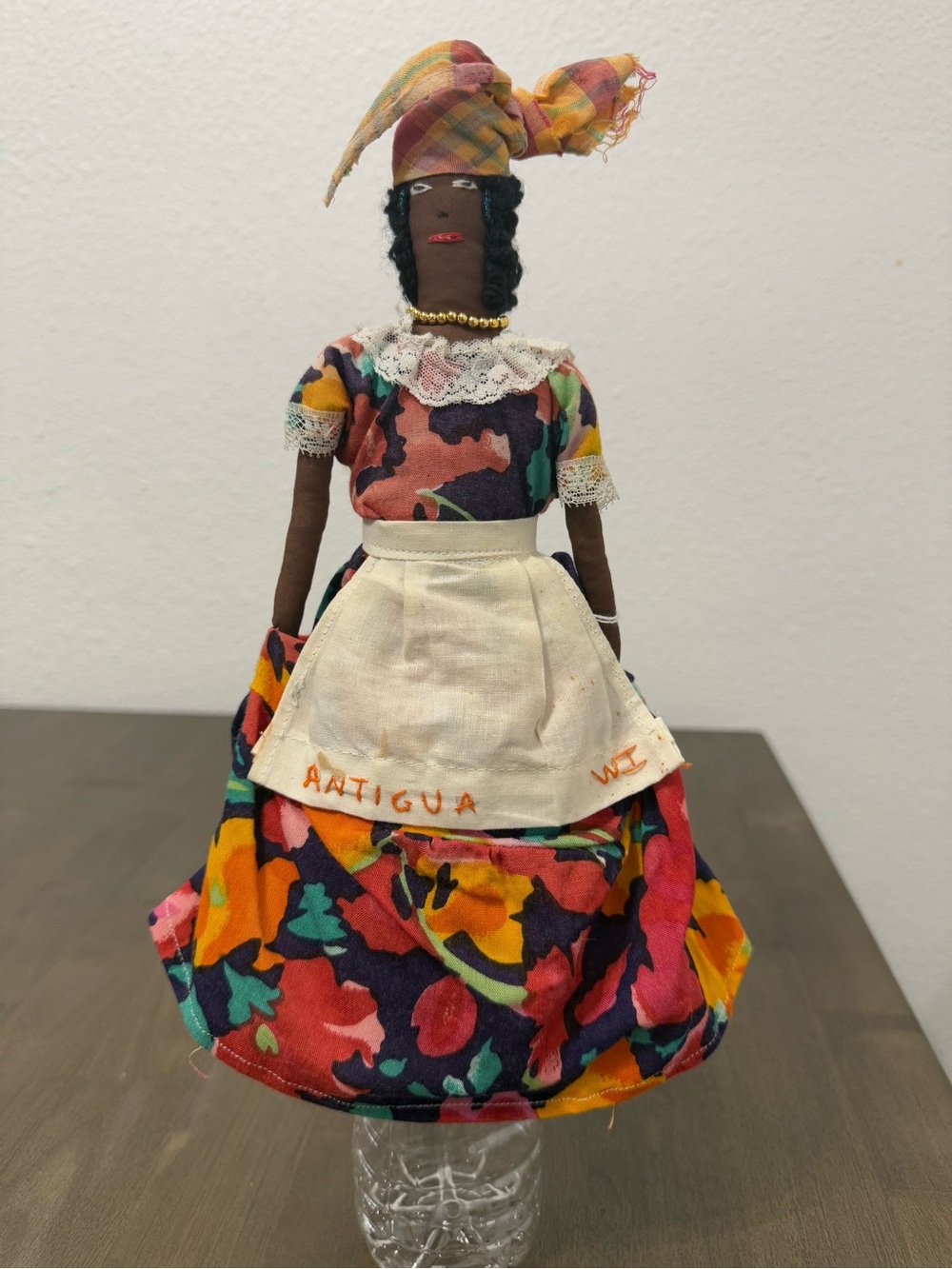 Antigua Colorful Floral Fabric Souvenir Doll with Cream Apron